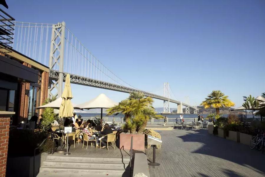 Diners enjoy a meal along the San Francisco waterfront.